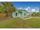 Charming single-story home with a well-manicured front yard and mature palm tree at 2931 23Rd N St, St Petersburg, FL 33713