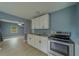 Modern kitchen featuring stainless-steel oven, ample counter space and updated cabinets at 2931 23Rd N St, St Petersburg, FL 33713