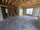 Unfinished basement with stairs, windows and walkout door provides a blank canvas for customization at 2932 Fairfield S Ave, St Petersburg, FL 33712