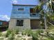 Exterior shot of a building in progress with weatherproofing, concrete, and framing, highlighting its modern construction at 2932 Fairfield S Ave, St Petersburg, FL 33712