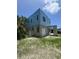 Image of the modern house under construction, showcasing concrete structure, framed openings, and garage door against a bright sky at 2932 Fairfield S Ave, St Petersburg, FL 33712