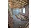 Unfinished garage space with a garage door, windows and some lumber ready for customizations at 2932 Fairfield S Ave, St Petersburg, FL 33712