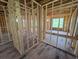 Unfinished room shows wooden framework, window placement, and flooring waiting to be personalized at 2932 Fairfield S Ave, St Petersburg, FL 33712