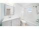Bright bathroom with updated vanity, mirror, and shower over tub at 3021 Jarvis St, Holiday, FL 34690