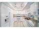 Modern kitchen with white cabinetry, granite countertops, and stainless steel appliances at 3021 Jarvis St, Holiday, FL 34690