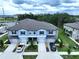 An aerial view shows an inviting home with tidy landscaping and a driveway at 30729 Veridian Way, Wesley Chapel, FL 33543