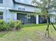 Home backyard featuring a screened porch/patio and well-maintained lawn for outdoor enjoyment and entertaining at 30729 Veridian Way, Wesley Chapel, FL 33543
