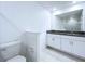 Modern bathroom featuring dual sinks, granite countertops, and a toilet at 30729 Veridian Way, Wesley Chapel, FL 33543