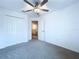 Cozy bedroom featuring a ceiling fan, carpet, and closet at 30729 Veridian Way, Wesley Chapel, FL 33543