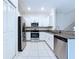Bright kitchen with white cabinets, stainless steel appliances, and granite countertops at 30729 Veridian Way, Wesley Chapel, FL 33543