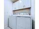 Functional laundry room with white appliances at 30729 Veridian Way, Wesley Chapel, FL 33543