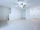 This room has tile flooring, neutral walls, and multiple entry points at 30729 Veridian Way, Wesley Chapel, FL 33543