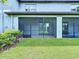 Cozy screened patio offers a relaxing outdoor living space and green backyard at 30729 Veridian Way, Wesley Chapel, FL 33543