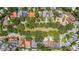 An aerial view of a neighborhood featuring manicured lawns and mature trees enhancing the curb appeal at 3144 W Waverly Park, Tampa, FL 33629