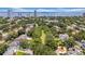 An aerial view of a beautiful residential neighborhood with lush trees and water views, and blue sky background at 3144 W Waverly Park, Tampa, FL 33629