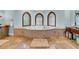 Relaxing bathroom with large soaking tub and three ornate windows at 3144 W Waverly Park, Tampa, FL 33629