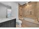 Modern bathroom featuring a sleek vanity with marble countertop and a luxurious shower with a glass enclosure at 3144 W Waverly Park, Tampa, FL 33629