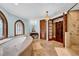 Bathroom with soaking tub, walk-in shower, and ornate windows at 3144 W Waverly Park, Tampa, FL 33629