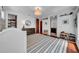 Charming bedroom with wood floors, light walls, striped rug, and decorative dresser, and shelving at 3144 W Waverly Park, Tampa, FL 33629