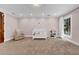 Well-lit Bedroom with carpet, large windows, and a cozy armchair at 3144 W Waverly Park, Tampa, FL 33629