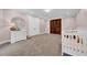 Comfortable Bedroom with a dresser, crib, and classic design elements at 3144 W Waverly Park, Tampa, FL 33629
