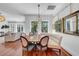 Elegant dining area featuring a round table, custom seating, and natural light through large windows at 3144 W Waverly Park, Tampa, FL 33629