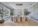 Dining room with stylish lighting, marble-top table, and accent wallpaper at 3144 W Waverly Park, Tampa, FL 33629