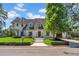 Elegant two-story home with lush lawn, manicured hedges, and brick walkway at 3144 W Waverly Park, Tampa, FL 33629