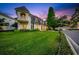 Elegant home with manicured lawn and a charming balcony with a beautiful lawn at 3144 W Waverly Park, Tampa, FL 33629
