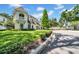 Charming two-story home with lush green lawn and manicured landscaping at 3144 W Waverly Park, Tampa, FL 33629