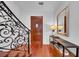 An elegant foyer featuring hardwood floors, a decorative staircase, and stylish console table at 3144 W Waverly Park, Tampa, FL 33629