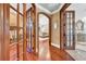 Hallway leading to the bedroom and bath with beautiful wood floors and natural light at 3144 W Waverly Park, Tampa, FL 33629