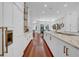 Modern kitchen with white cabinetry, marble countertops, stainless steel appliances, and hardwood floors at 3144 W Waverly Park, Tampa, FL 33629