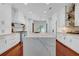 Spacious kitchen with a large marble island, custom cabinetry, and stainless steel appliances throughout at 3144 W Waverly Park, Tampa, FL 33629