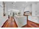 Bright kitchen with a marble island countertop, stainless steel appliances, and wooden flooring at 3144 W Waverly Park, Tampa, FL 33629