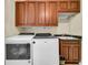 Functional laundry room with washer, dryer, cabinets, and sink at 3144 W Waverly Park, Tampa, FL 33629