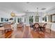 Bright living room featuring hardwood floors, large windows, and stylish furnishings for a modern aesthetic at 3144 W Waverly Park, Tampa, FL 33629