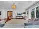 The living room features hardwood floors, plentiful windows, designer lighting and seating for the whole Gathering at 3144 W Waverly Park, Tampa, FL 33629