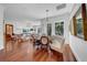 Spacious living and dining area featuring hardwood floors, natural light, and modern decor throughout at 3144 W Waverly Park, Tampa, FL 33629