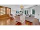 The living room has hardwood floors, plentiful windows with modern draperies, and seating for the whole Gathering at 3144 W Waverly Park, Tampa, FL 33629