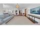 The living room features hardwood floors, plentiful windows, designer lighting and flows openly to the kitchen at 3144 W Waverly Park, Tampa, FL 33629