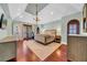 Spacious main bedroom featuring hardwood floors, light blue walls, and large windows at 3144 W Waverly Park, Tampa, FL 33629