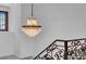 An elegant chandelier is seen over a staircase with decorative ironwork at 3144 W Waverly Park, Tampa, FL 33629