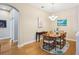 Elegant dining room featuring hardwood floors, natural light, and modern decor at 3228 Stonegate Falls Dr, Land O Lakes, FL 34638