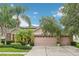 Charming home featuring a well-manicured lawn and a spacious three-car garage at 3228 Stonegate Falls Dr, Land O Lakes, FL 34638