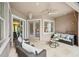 Cozy covered patio with comfortable seating, perfect for outdoor relaxation and entertainment at 3228 Stonegate Falls Dr, Land O Lakes, FL 34638