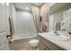 Bathroom featuring a tub, stylish sink, and decorative neutral tones at 36995 Sagemoor Dr, Zephyrhills, FL 33541
