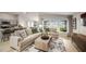 Spacious living room with an open layout and an abundance of natural light at 36995 Sagemoor Dr, Zephyrhills, FL 33541