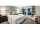 Serene main bedroom with a large bed, soft lighting, and neutral tones, creating a relaxing and comfortable space at 36995 Sagemoor Dr, Zephyrhills, FL 33541
