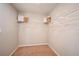 Walk-in closet includes carpet floors and shelves with hangers for optimal storage at 36995 Sagemoor Dr, Zephyrhills, FL 33541
